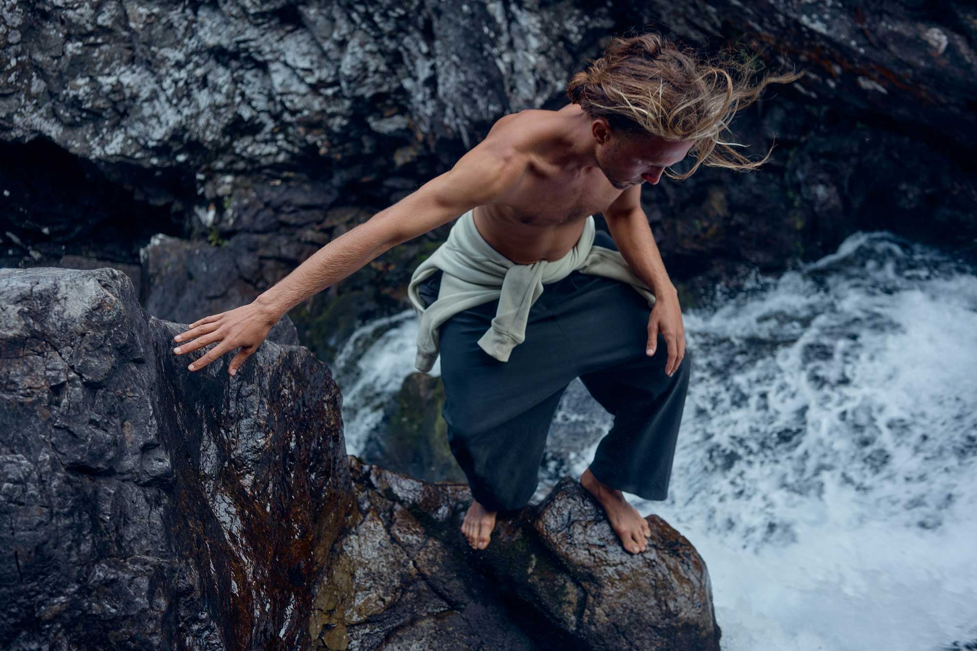 Active person climbing rocks